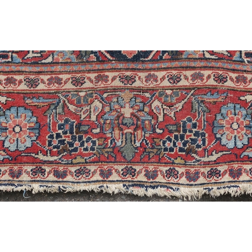 93 - A BLUE GROUND EASTERN RUG WITH CENTRAL MEDALLION