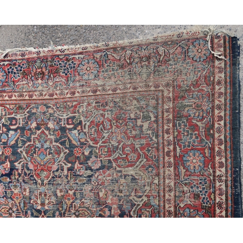 93 - A BLUE GROUND EASTERN RUG WITH CENTRAL MEDALLION