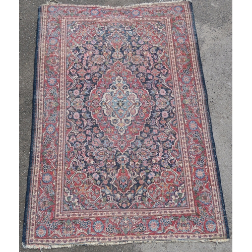 93 - A BLUE GROUND EASTERN RUG WITH CENTRAL MEDALLION