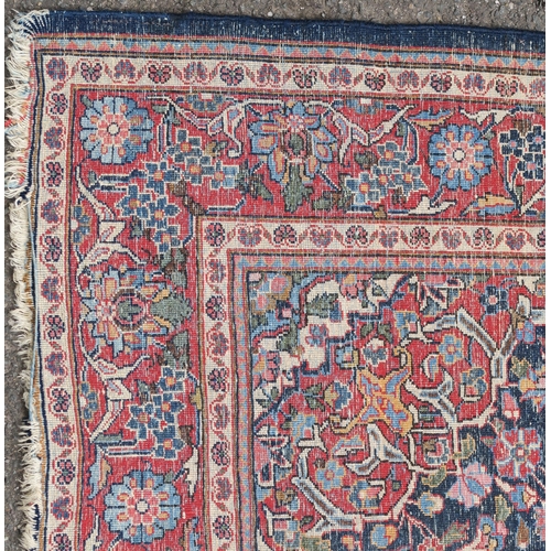 93 - A BLUE GROUND EASTERN RUG WITH CENTRAL MEDALLION