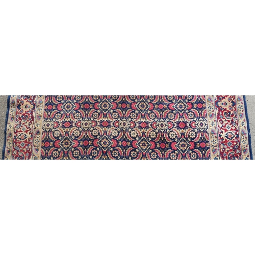 97 - A BLUE GROUND EASTERN RUG WITH ALLOVER DESIGN