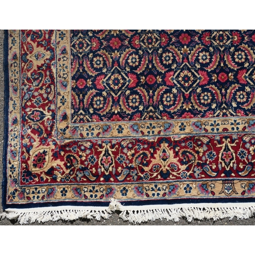 97 - A BLUE GROUND EASTERN RUG WITH ALLOVER DESIGN