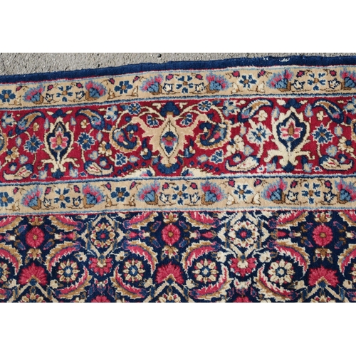 97 - A BLUE GROUND EASTERN RUG WITH ALLOVER DESIGN