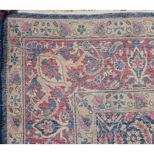 97 - A BLUE GROUND EASTERN RUG WITH ALLOVER DESIGN