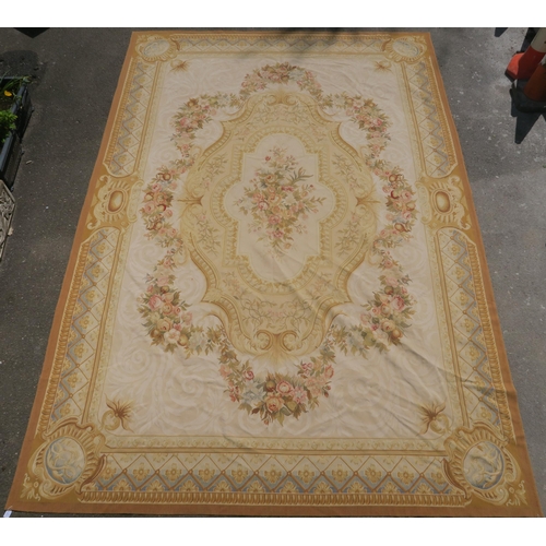 99 - A CREAM GROUND AUBUSSON STYLE RUG WITH CENTRAL MEDALLION