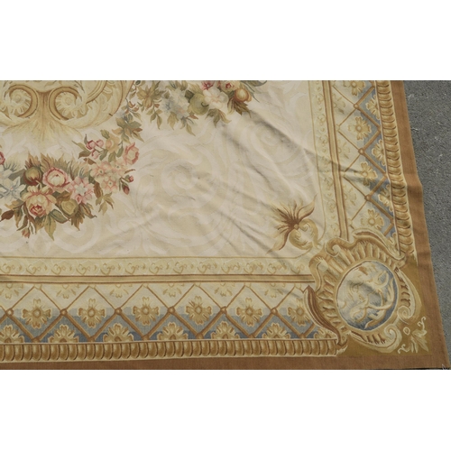 99 - A CREAM GROUND AUBUSSON STYLE RUG WITH CENTRAL MEDALLION