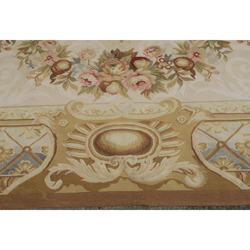 99 - A CREAM GROUND AUBUSSON STYLE RUG WITH CENTRAL MEDALLION