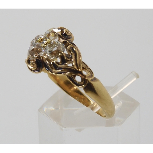 670 - AN ART NOUVEAU DIAMOND RINGthe yellow metal mount with chased foliate design is set with estimated a... 