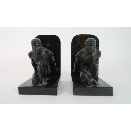 283 - A PAIR OF BRONZE BOOKENDS