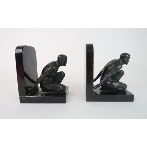 283 - A PAIR OF BRONZE BOOKENDS