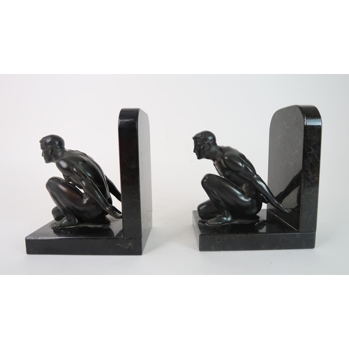 283 - A PAIR OF BRONZE BOOKENDS