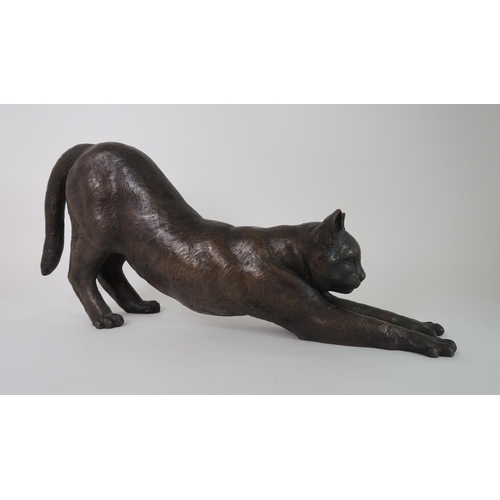 288 - A BRONZED SCULPTURE OF A STRETCHING CAT