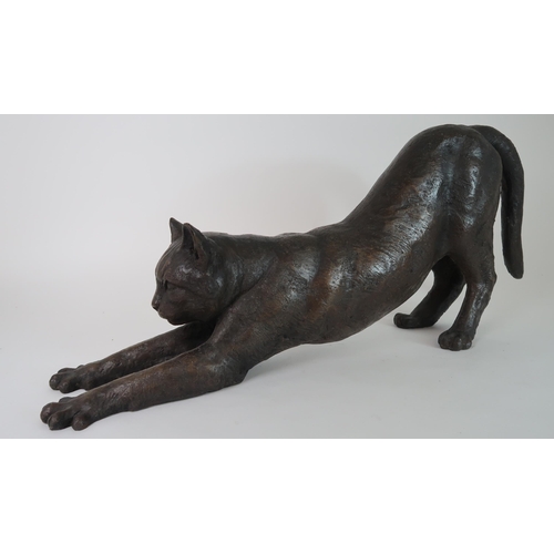 288 - A BRONZED SCULPTURE OF A STRETCHING CAT