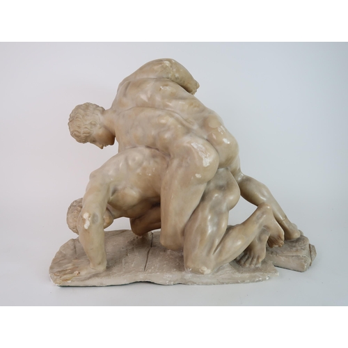 293 - A CARVED ALABASTER SCULPTURE OF THE WRESTLERS