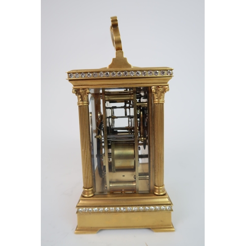 321 - A FRENCH GILDED METAL AND PASTE SET REPEATER CARRIAGE CLOCK