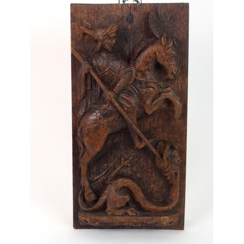 376 - AN EARLY CARVED OAK PANEL DEPICTING GEORGE AND THE DRAGON