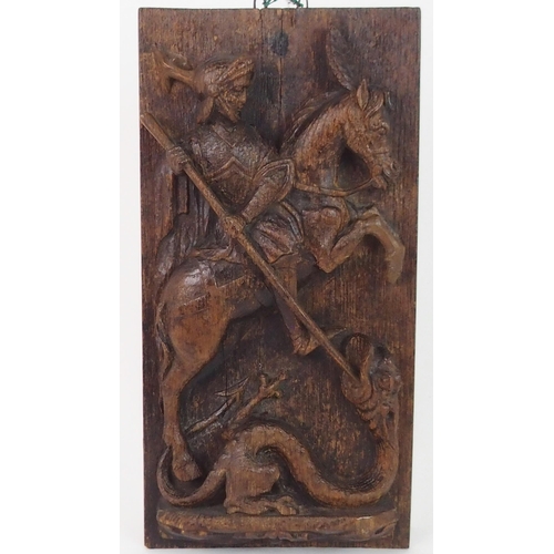 376 - AN EARLY CARVED OAK PANEL DEPICTING GEORGE AND THE DRAGON