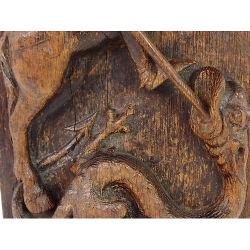 376 - AN EARLY CARVED OAK PANEL DEPICTING GEORGE AND THE DRAGON