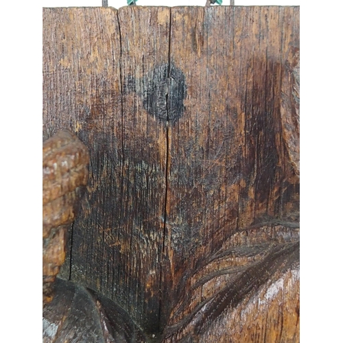 376 - AN EARLY CARVED OAK PANEL DEPICTING GEORGE AND THE DRAGON