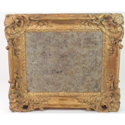 379 - AN EARLY CARVED FRAME WITH MIRROR PLATE