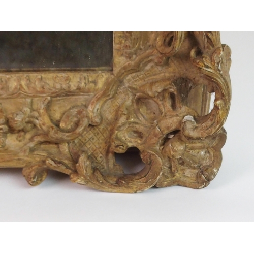 379 - AN EARLY CARVED FRAME WITH MIRROR PLATE