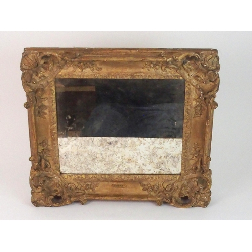 379 - AN EARLY CARVED FRAME WITH MIRROR PLATE