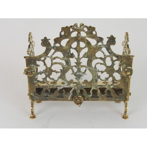 382 - A BRASS HANUKKAH WITH PIERCED BACK PLATE