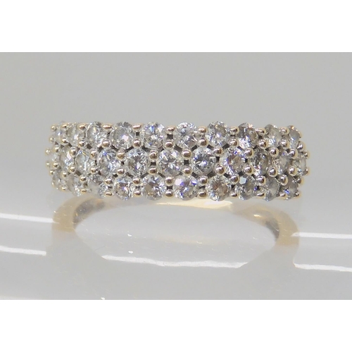 505 - A 9CT GOLD THREE ROW DIAMOND CLUSTER RING