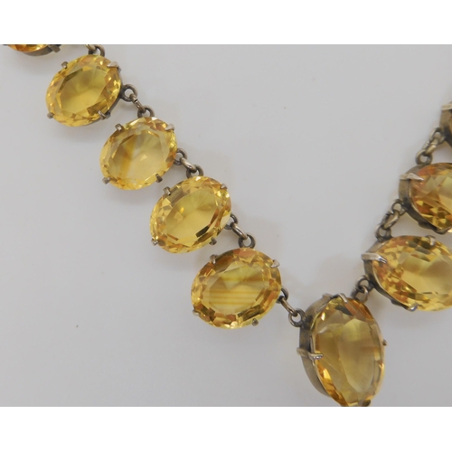 515 - A WHITE METAL MOUNTED GRADUATED CITRINE SET NECKLET