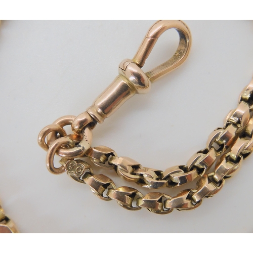 517 - A 9CT GOLD FANCY LINK GUARD CHAIN WITH A CITRINE FOB