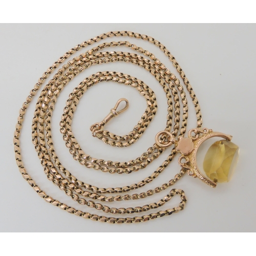 517 - A 9CT GOLD FANCY LINK GUARD CHAIN WITH A CITRINE FOB