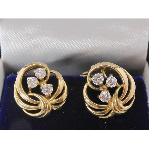 519 - A PAIR OF 9CT GOLD AND DIAMOND EARRINGS