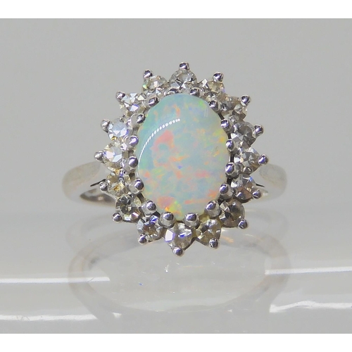 526 - AN 18CT WHITE GOLD OPAL AND DIAMOND RING