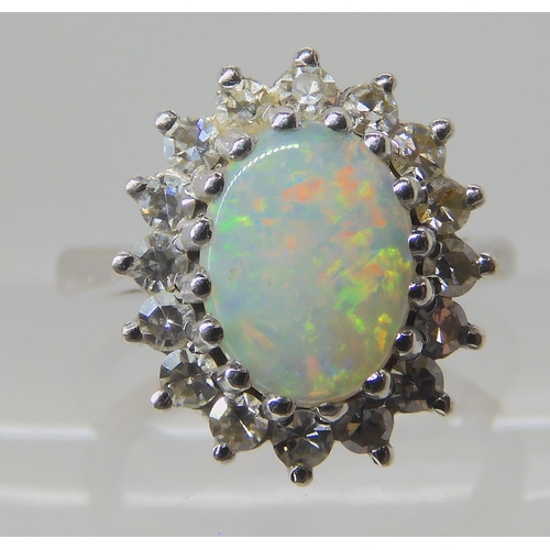 526 - AN 18CT WHITE GOLD OPAL AND DIAMOND RING