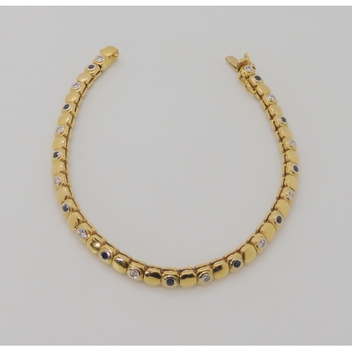 533 - AN 18CT GOLD SAPPHIRE AND DIAMOND BRACELET