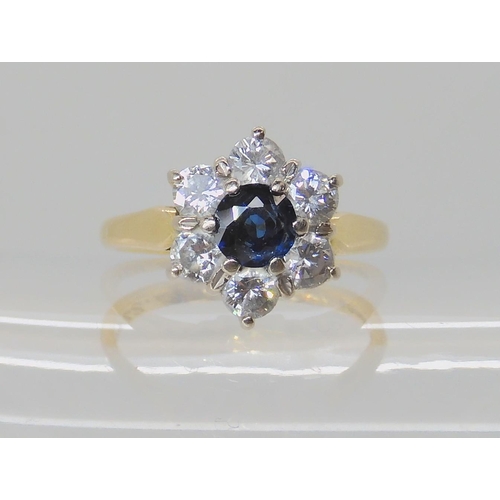 534 - AN 18CT SAPPHIRE AND DIAMOND FLOWER RING