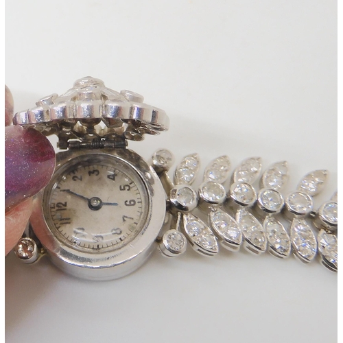 672 - A WHITE METAL DIAMOND SET COCKTAIL WATCH