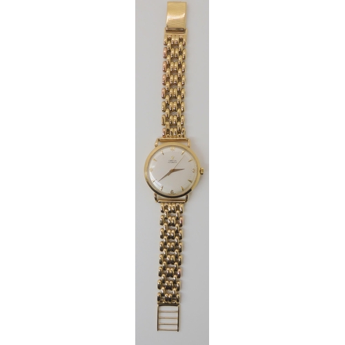 674 - A 9CT GOLD OMEGA AUTOMATIC WRISTWATCH