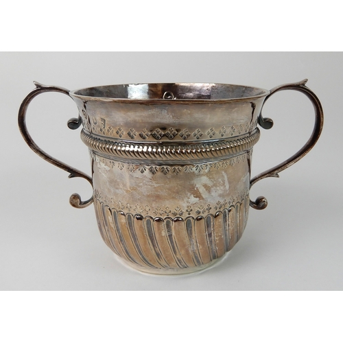 693 - AN EARLY 18TH CENTURY SILVER PORRINGER