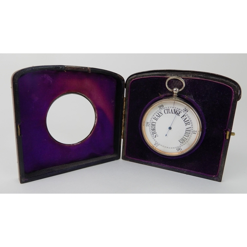 697 - A WHITE METAL CASED BAROMETER