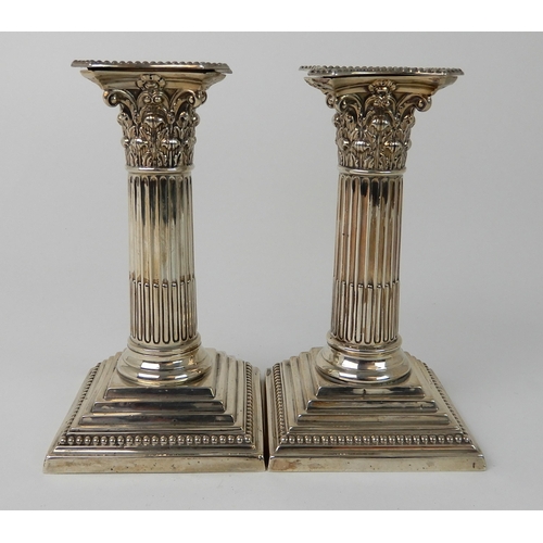 699 - A PAIR OF LATE VICTORIAN SILVER CANDLESTICKS