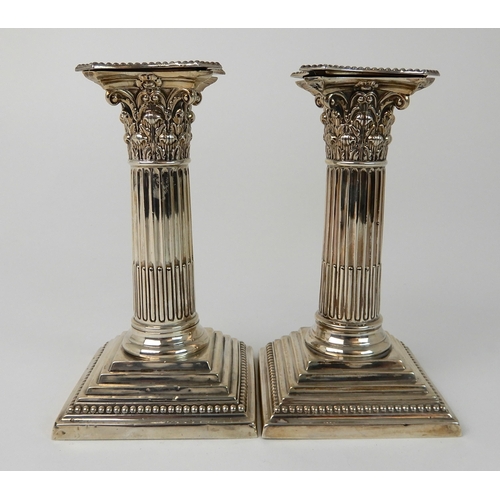 699 - A PAIR OF LATE VICTORIAN SILVER CANDLESTICKS