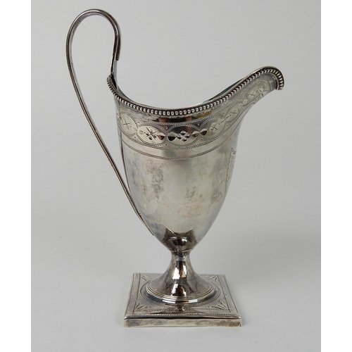 703 - A SILVER CREAM JUG