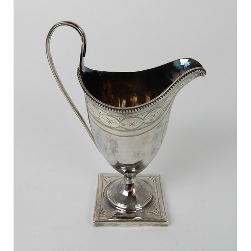 703 - A SILVER CREAM JUG