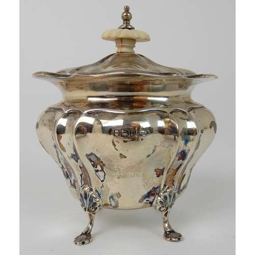 711 - A SILVER TEA CADDY