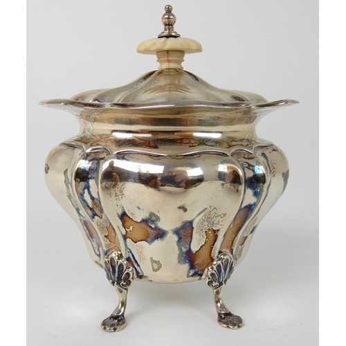 711 - A SILVER TEA CADDY