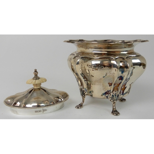 711 - A SILVER TEA CADDY