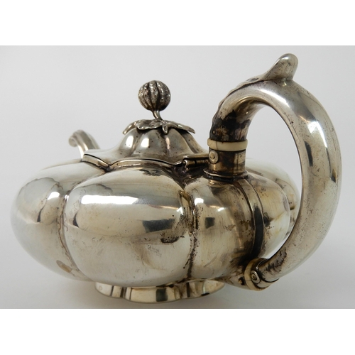 713 - A SILVER TEAPOT