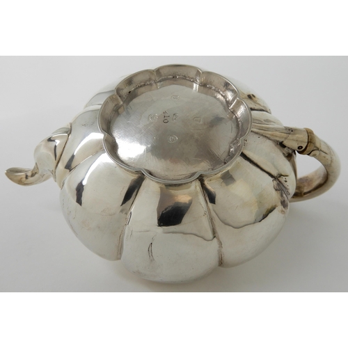 713 - A SILVER TEAPOT