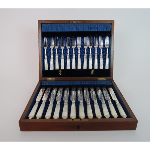 745 - A CASED TWENTY FOUR PIECE SILVER AND MOTHER OF PEARL FRUIT CUTLERY SET